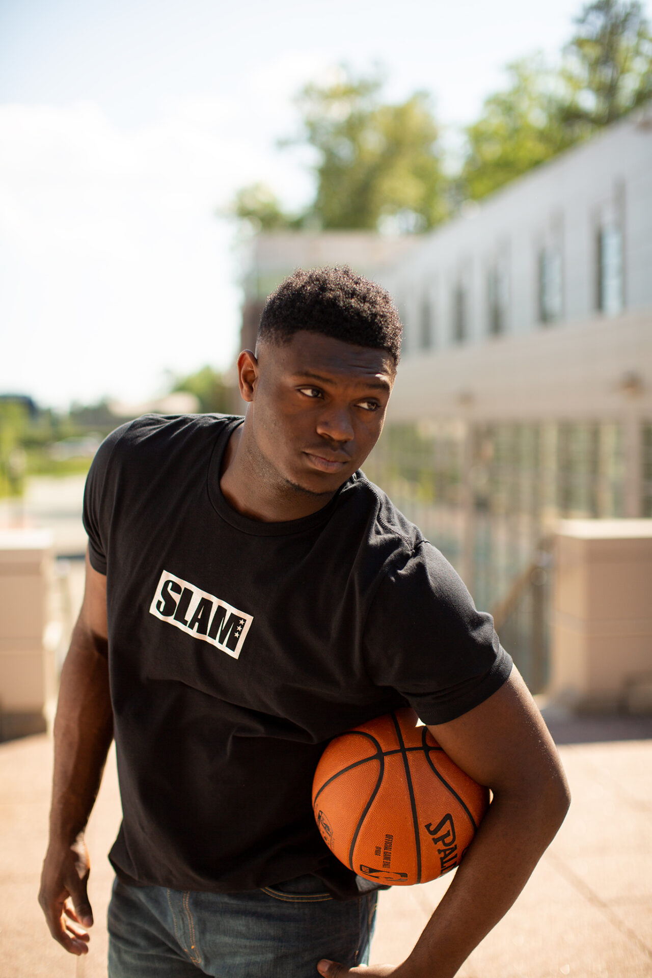 Zion Williamson with a basketball just a month before being selected with the #1 overall pick in the 2019 NBA Draft.